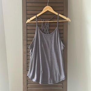 Purple activewear racer back tank with knot detail in back. Size medium.